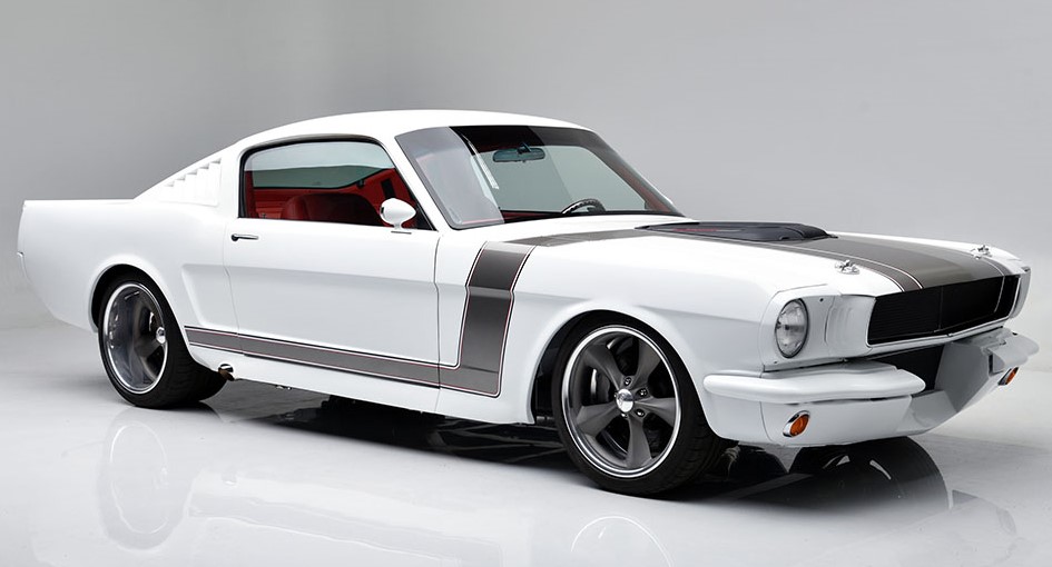 This Custom 1965 Mustang has a 5.0 L Coyote with 460 hp and 6 Speed Manual